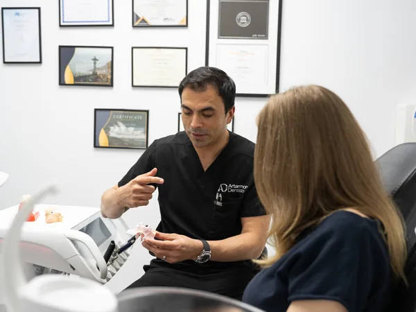 Dr Nick Mehta explaining treatment to a patient
